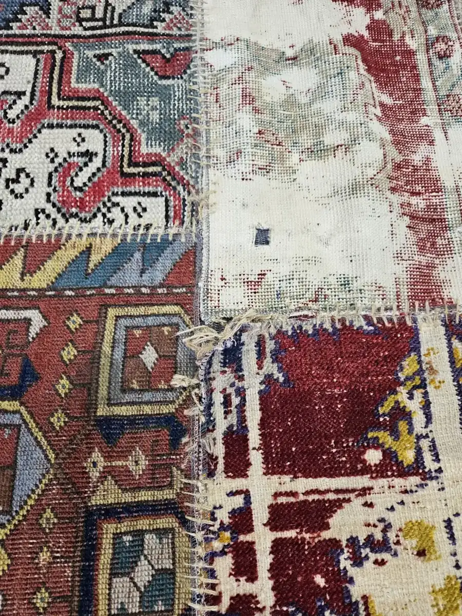 Close detail of an antique patchwork rug, clean after washing